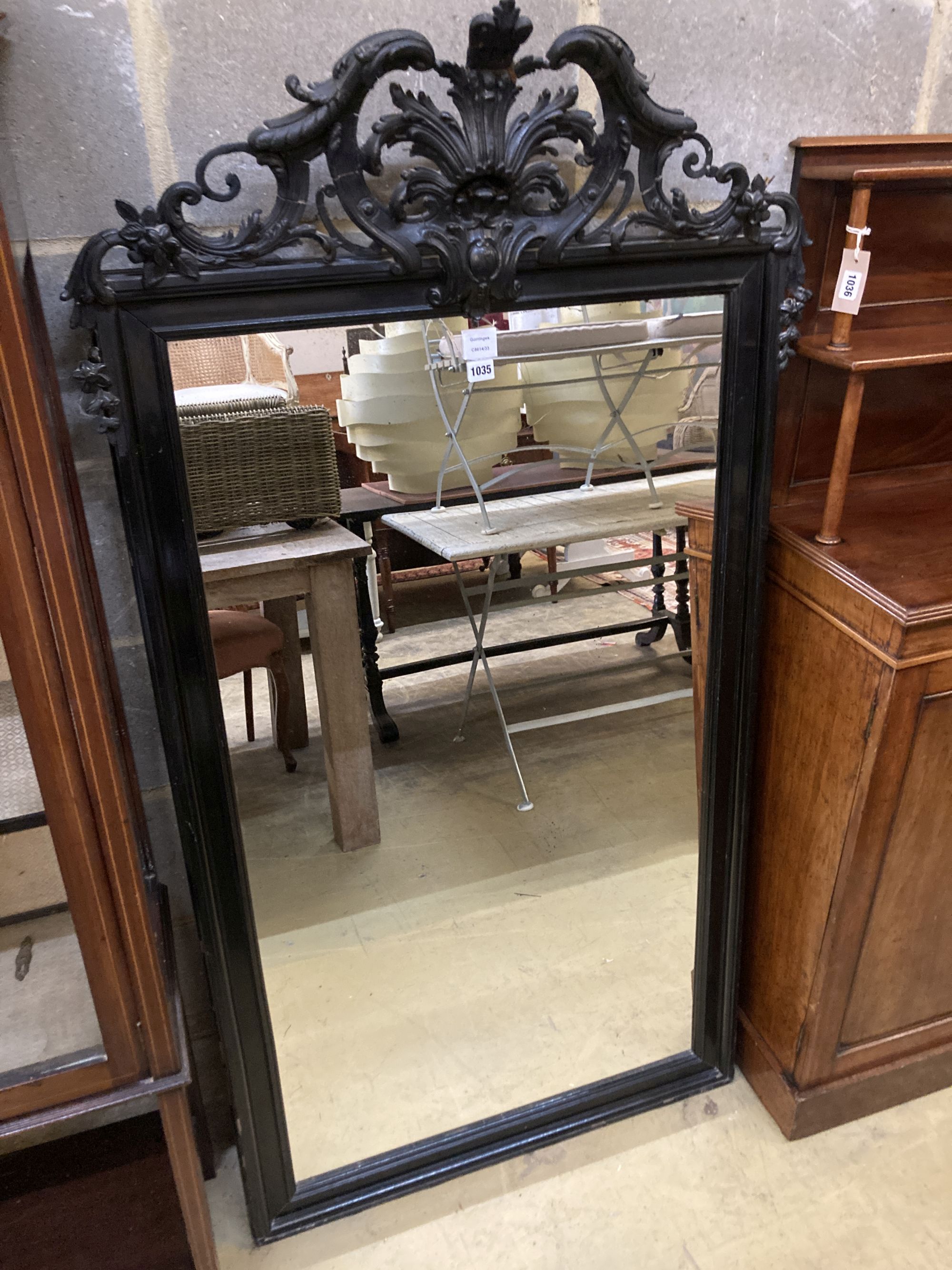 A 19th century French ebonised wall mirror, width 86cm, height 158cm